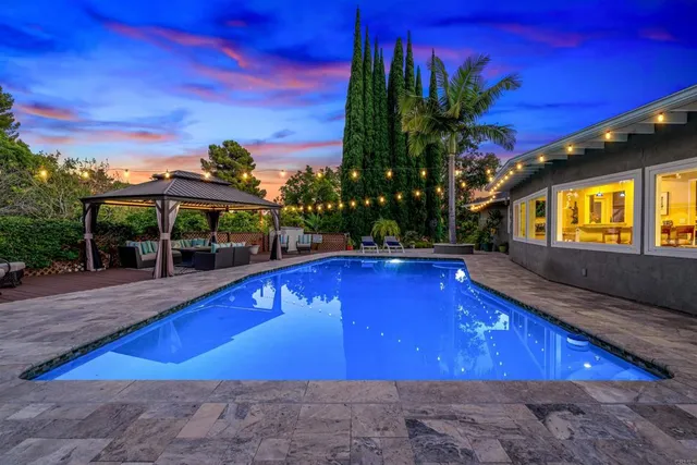 a view of a house with a swimming pool