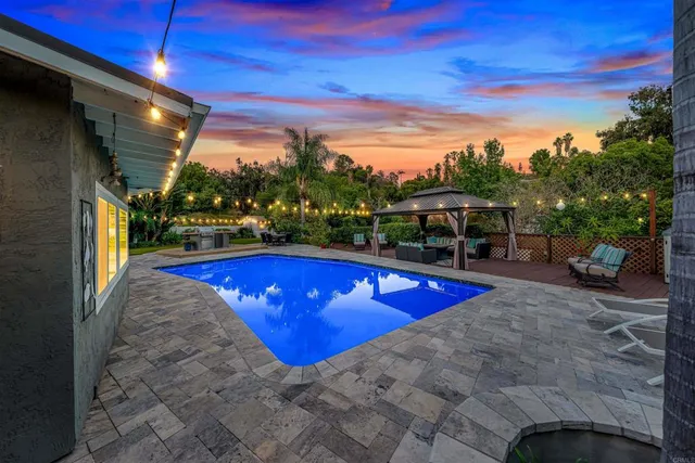 a view of a swimming pool with a patio