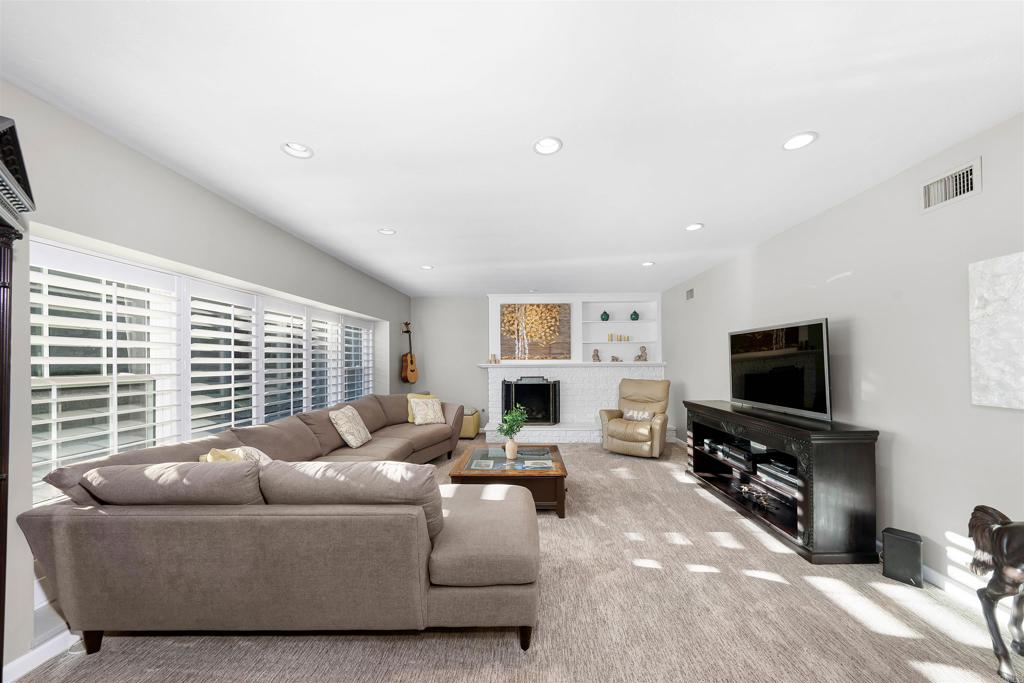 4711 Lorena Place El Cajon, CA 92020 - Photo 4 of 33 a living room with furniture and a flat screen tv