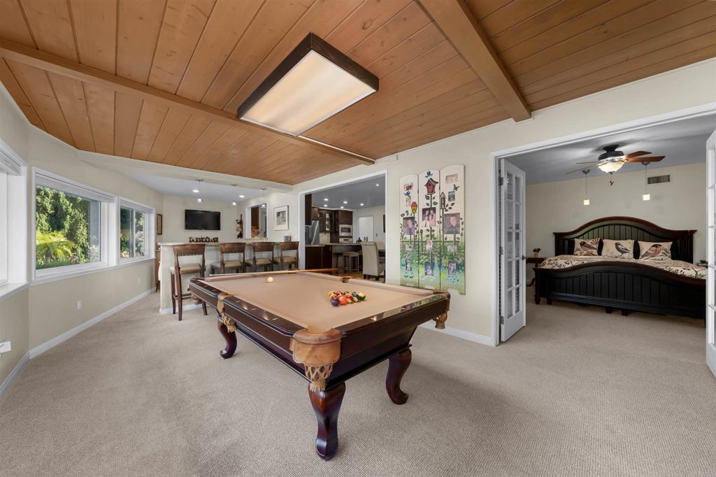 4711 Lorena Place El Cajon, CA 92020 - Photo 9 of 33 a living room with furniture a pool table and a large window