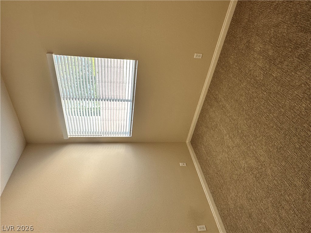 1922 Thunder Ridge Circle Henderson, NV 89012 - Photo 17 of 27 Sun-filled room featuring plush carpeting and a large window.
