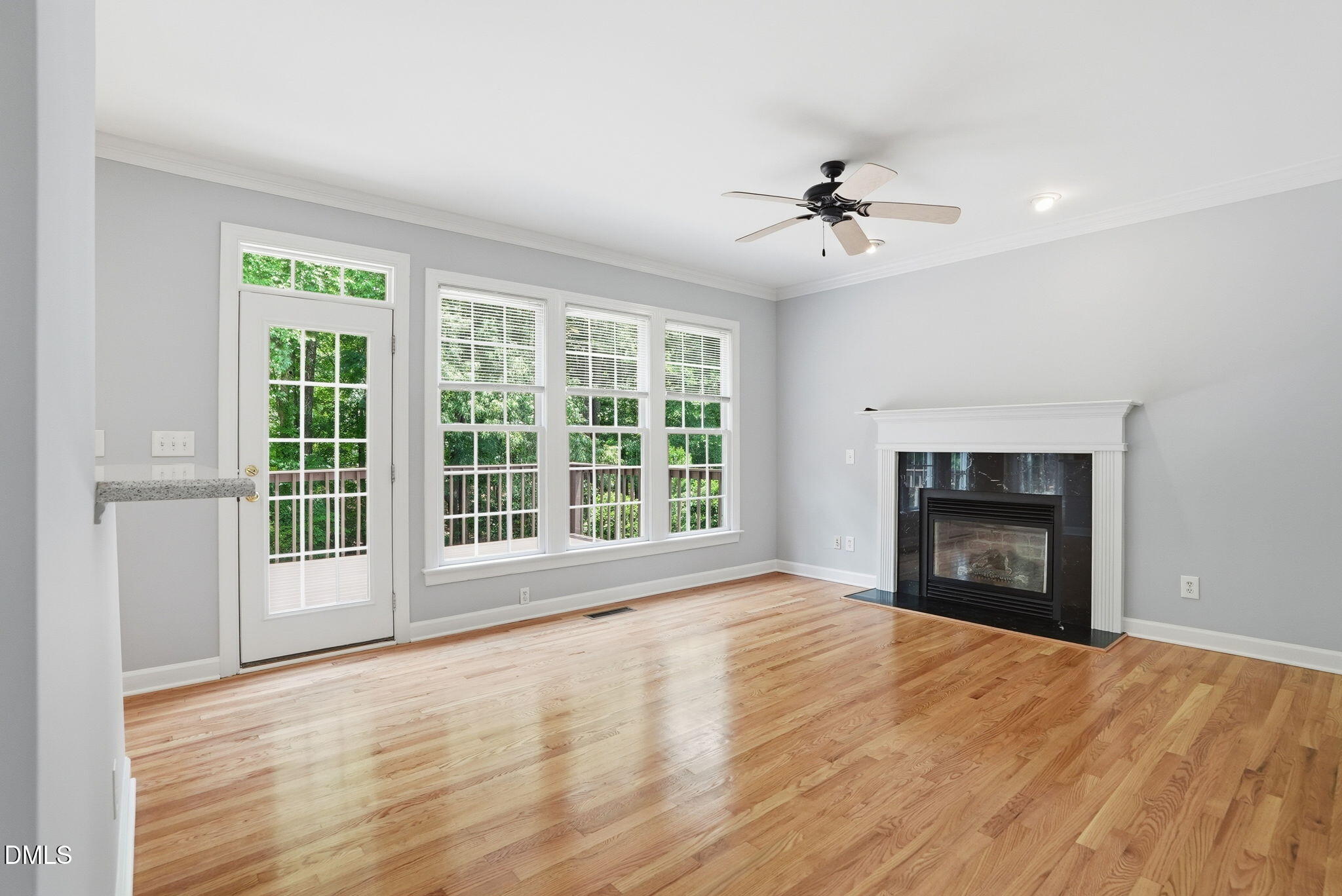 7 Morgans Ridge Lane Durham, NC 27707 - Photo 19 of 75 a view of an empty room with a fireplace and a window