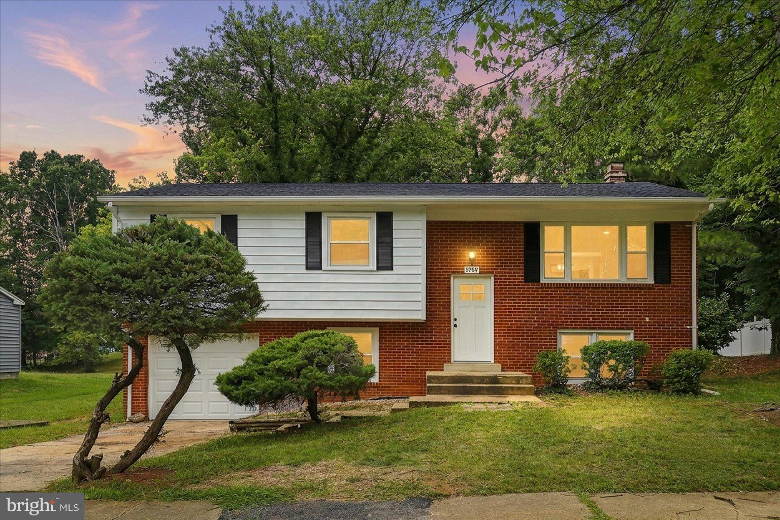 9309 Cross Bow Road Fort Washington, MD 20744 - Photo 1 of 53 Charming split-level home at dusk.
