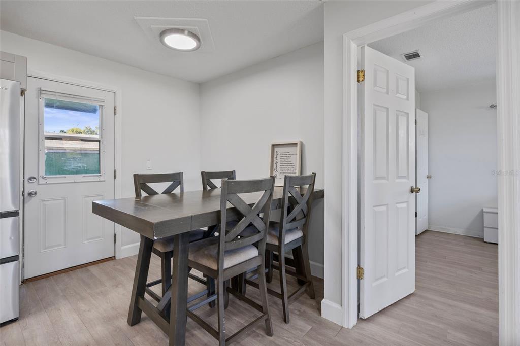 114 Inwood Circle Brandon, FL 33510 - Photo 12 of 31 a view of a dining room with furniture and wooden floor