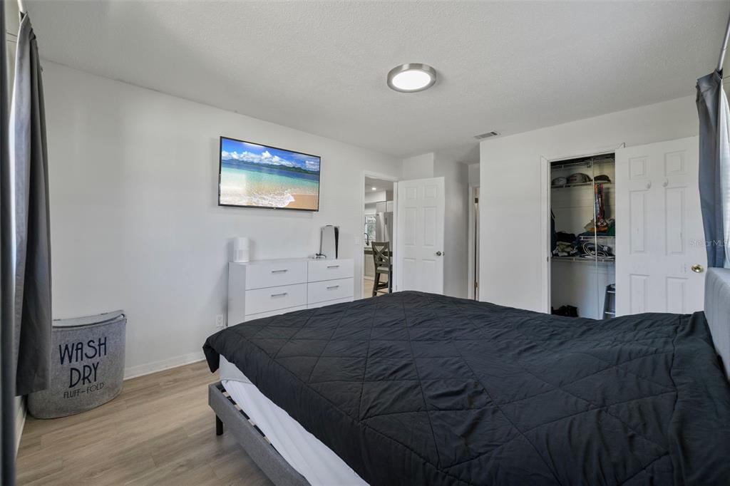 114 Inwood Circle Brandon, FL 33510 - Photo 14 of 31 a bedroom with a bed and a view of kitchen