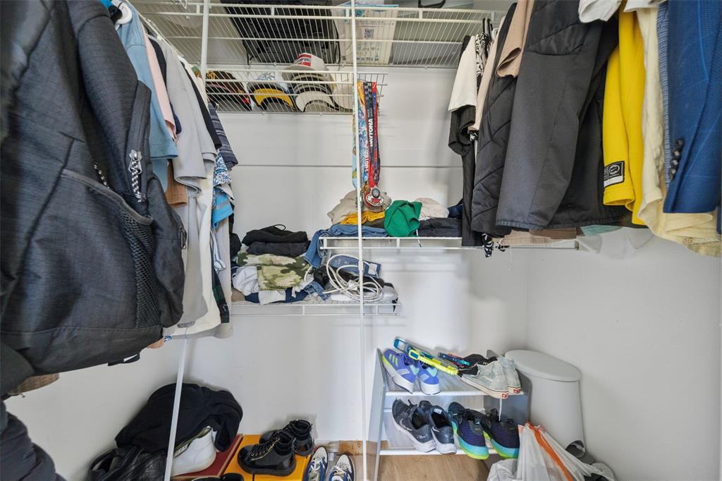114 Inwood Circle Brandon, FL 33510 - Photo 15 of 31 a view of walk in closet with clothes and shoes