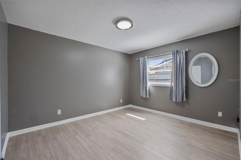 114 Inwood Circle Brandon, FL 33510 - Photo 17 of 31 an empty room with windows and mirror