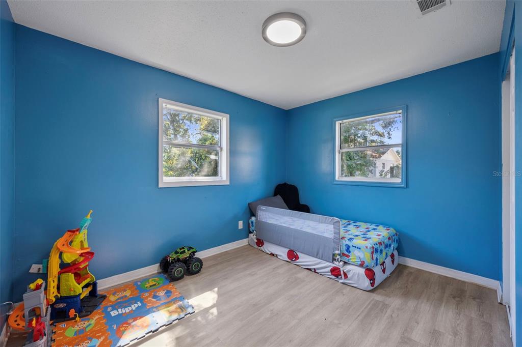 114 Inwood Circle Brandon, FL 33510 - Photo 19 of 31 a bedroom with bed and a window