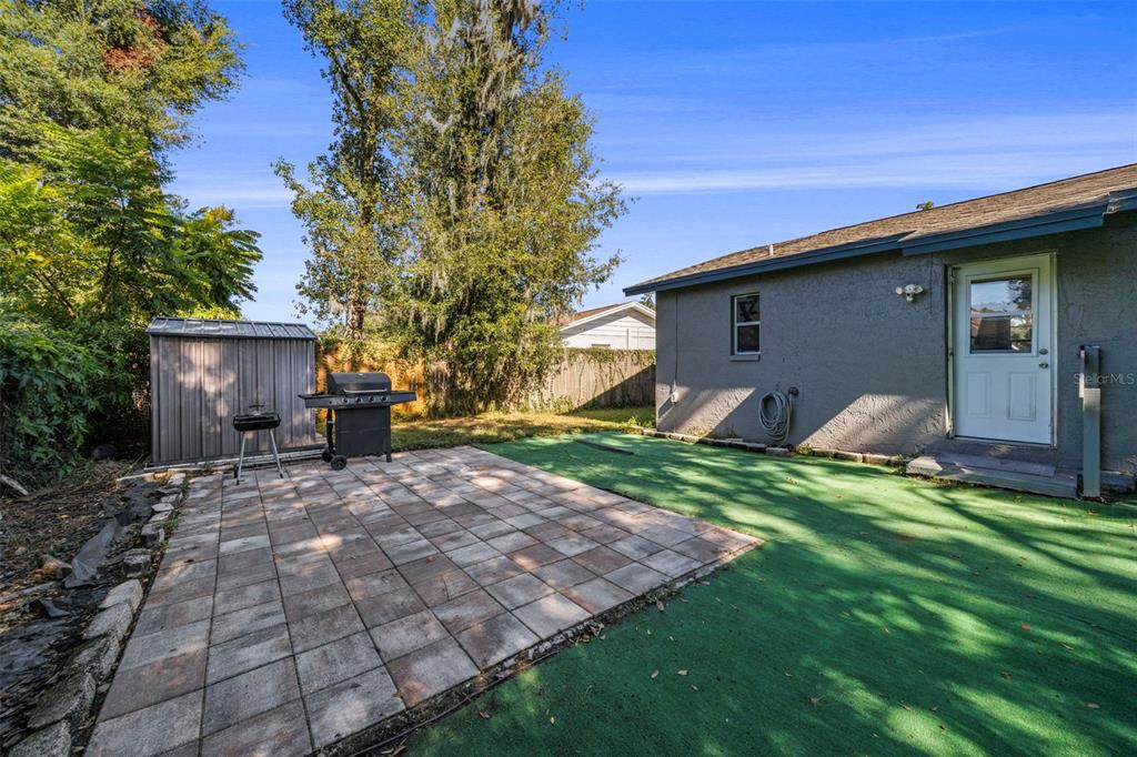 114 Inwood Circle Brandon, FL 33510 - Photo 24 of 31 a backyard of a house with barbeque oven and table