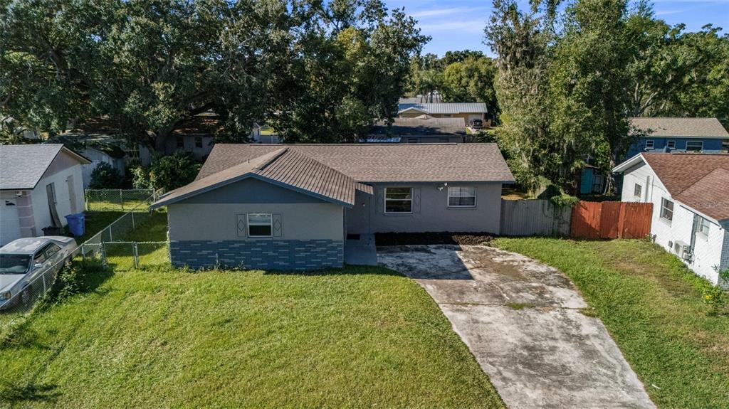 114 Inwood Circle Brandon, FL 33510 - Photo 26 of 31 a front view of house with yard and trees