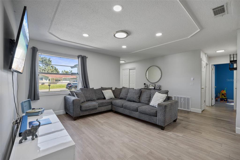 114 Inwood Circle Brandon, FL 33510 - Photo 5 of 31 a living room with furniture chandelier and a window
