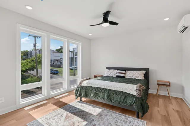 a bedroom with a bed and a window