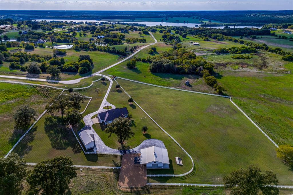 6980 Shore Crest Way Athens, TX 75752 - Photo 1 of 1 an aerial view of a house with a garden