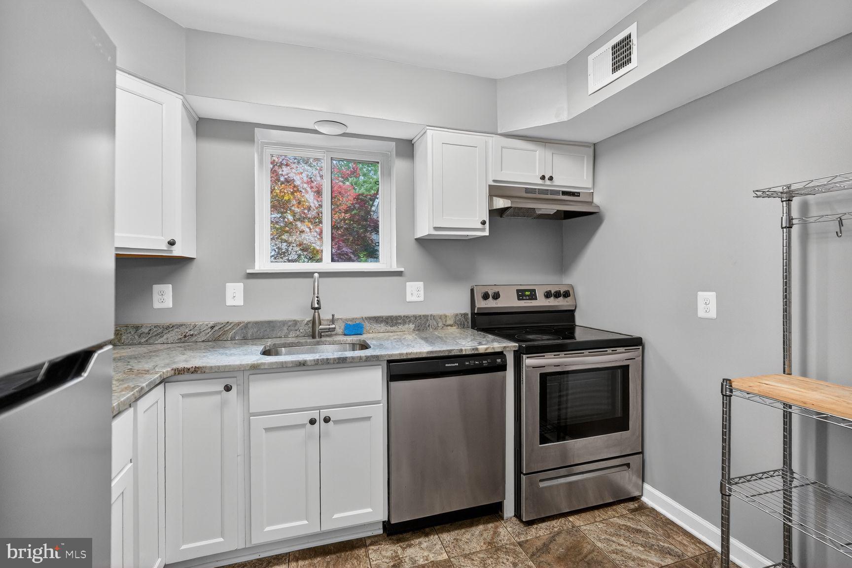 3216 Spartan Road, Unit 40 Olney, MD 20832 - Photo 5 of 25 Modern kitchen with sleek finishes.