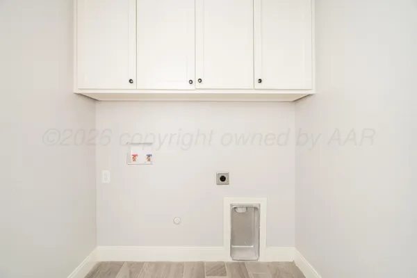 a view of cabinets and wooden floor