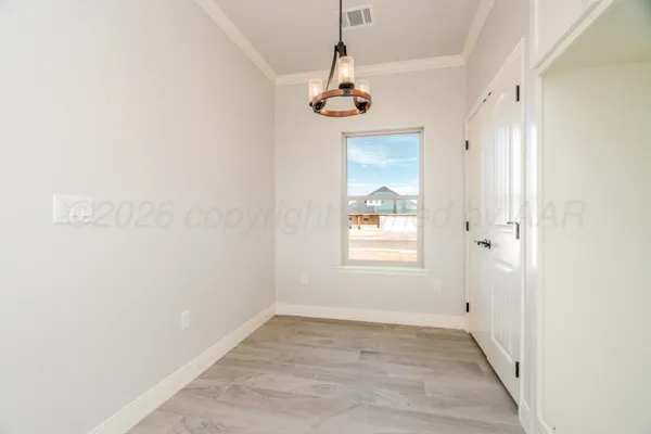 a view of an empty room with a window