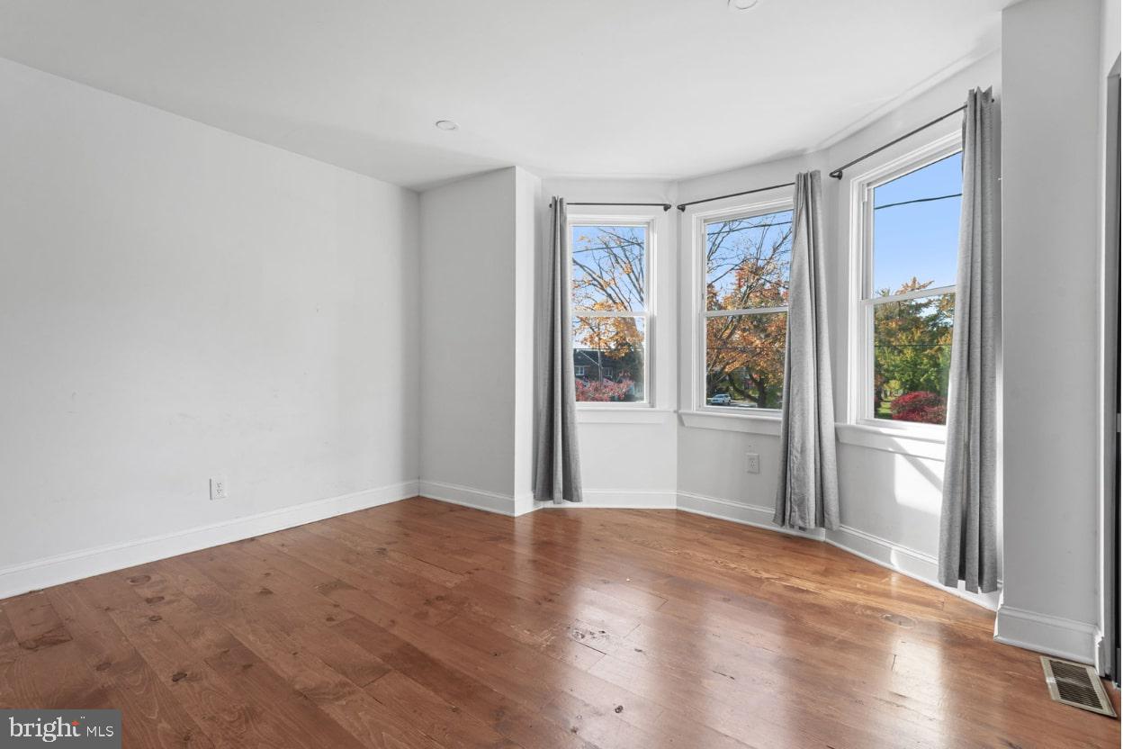 1103 Frances Avenue Lancaster, PA 17601 - Photo 13 of 15 a view of a big room with wooden floor and windows