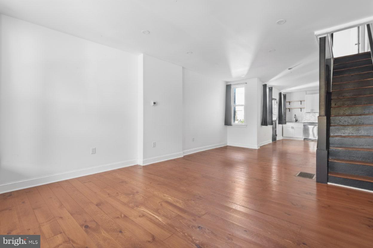 1103 Frances Avenue Lancaster, PA 17601 - Photo 5 of 15 a view of a hallway with wooden floor