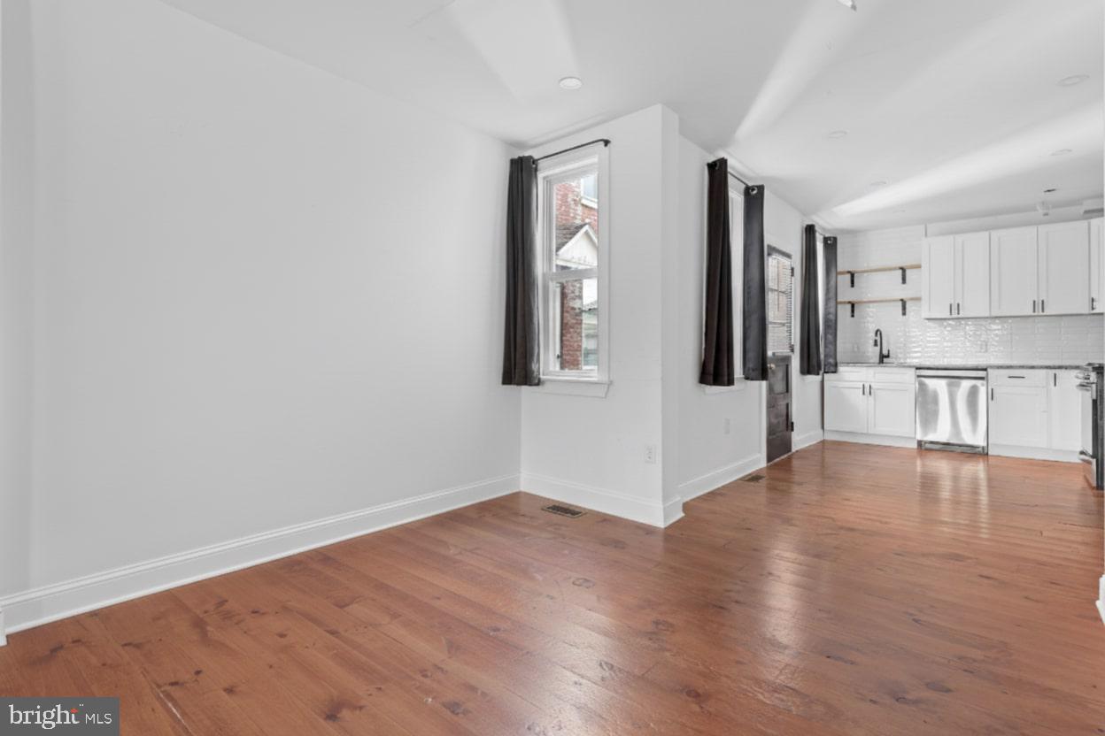1103 Frances Avenue Lancaster, PA 17601 - Photo 8 of 15 a view of a kitchen with wooden floor and a window