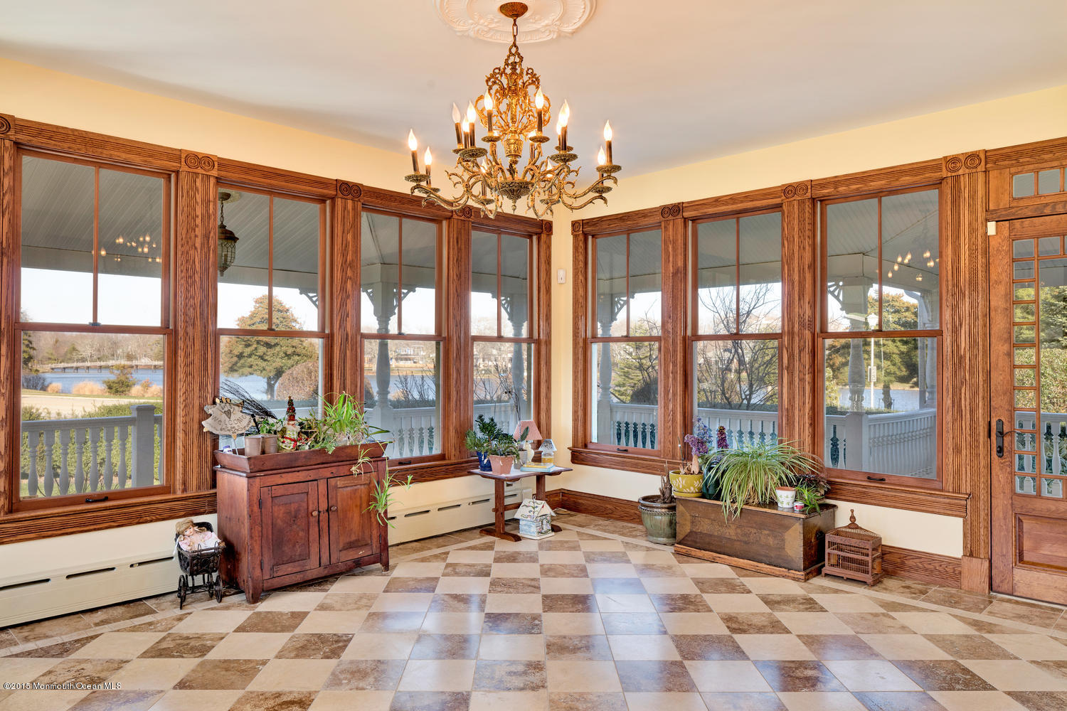 203 East Lake Avenue Spring Lake, NJ 07762 - Photo 13 of 55 a living room filled with furniture and a chandelier