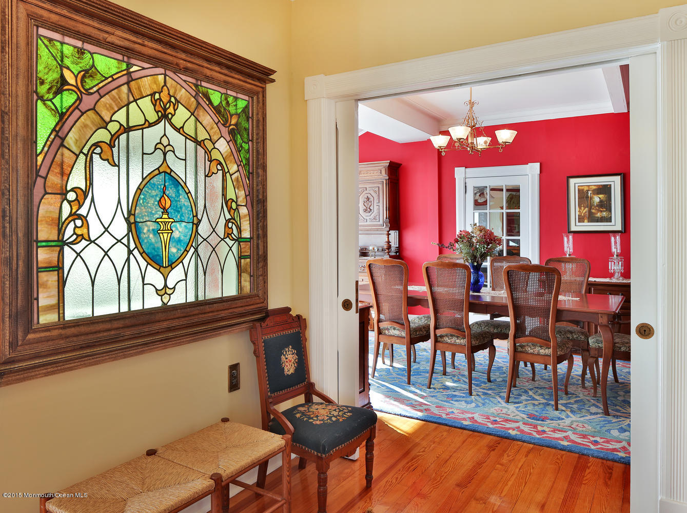 203 East Lake Avenue Spring Lake, NJ 07762 - Photo 15 of 55 a view of a dining room with furniture a chandelier and large windows