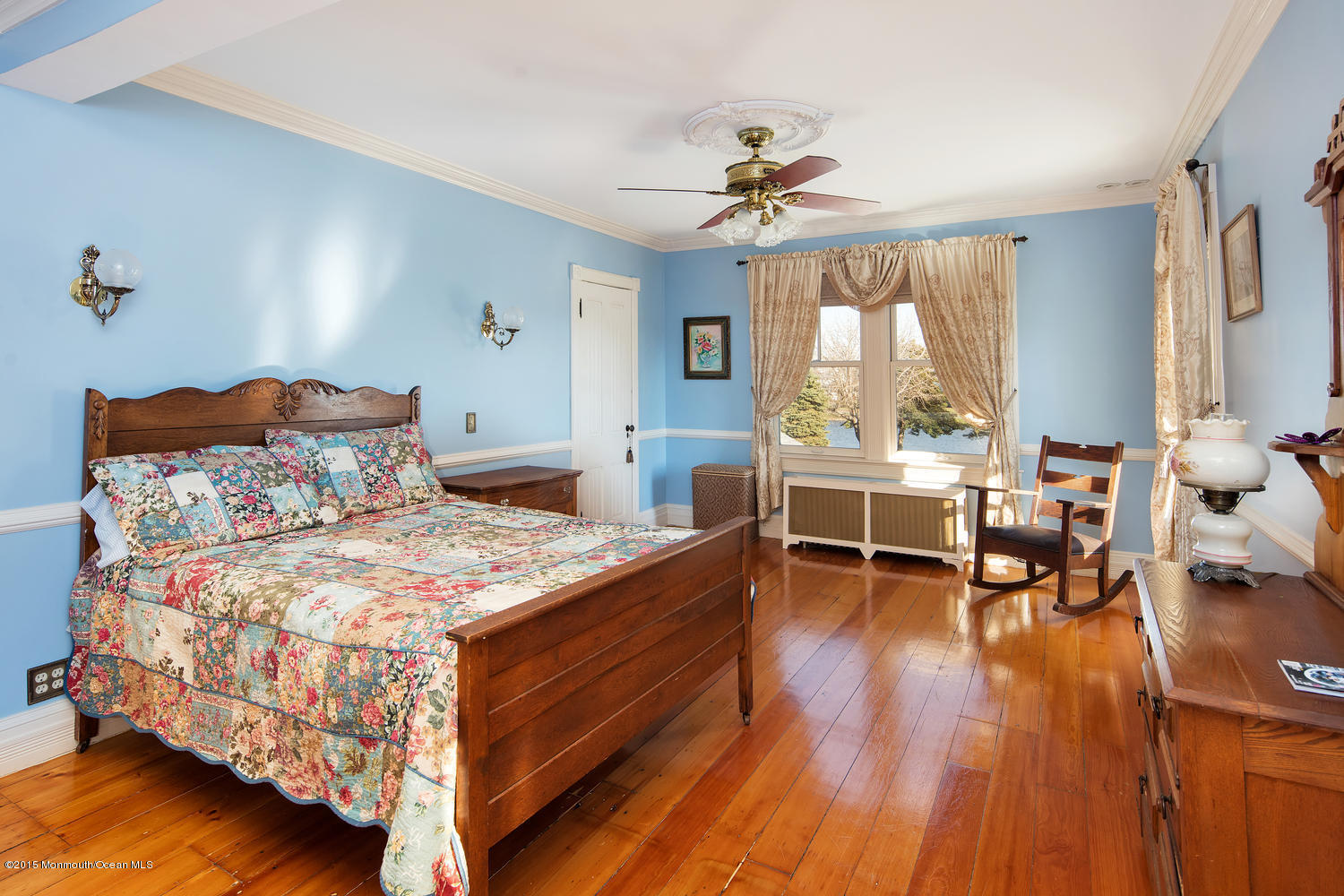 203 East Lake Avenue Spring Lake, NJ 07762 - Photo 31 of 55 a bedroom with a bed and wooden floor