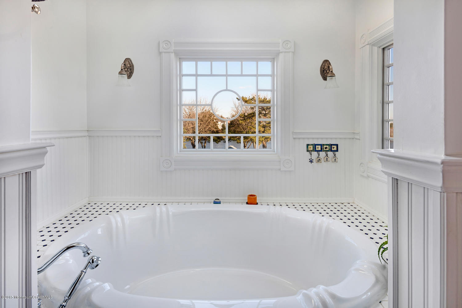 203 East Lake Avenue Spring Lake, NJ 07762 - Photo 32 of 55 a bathroom with a tub and window