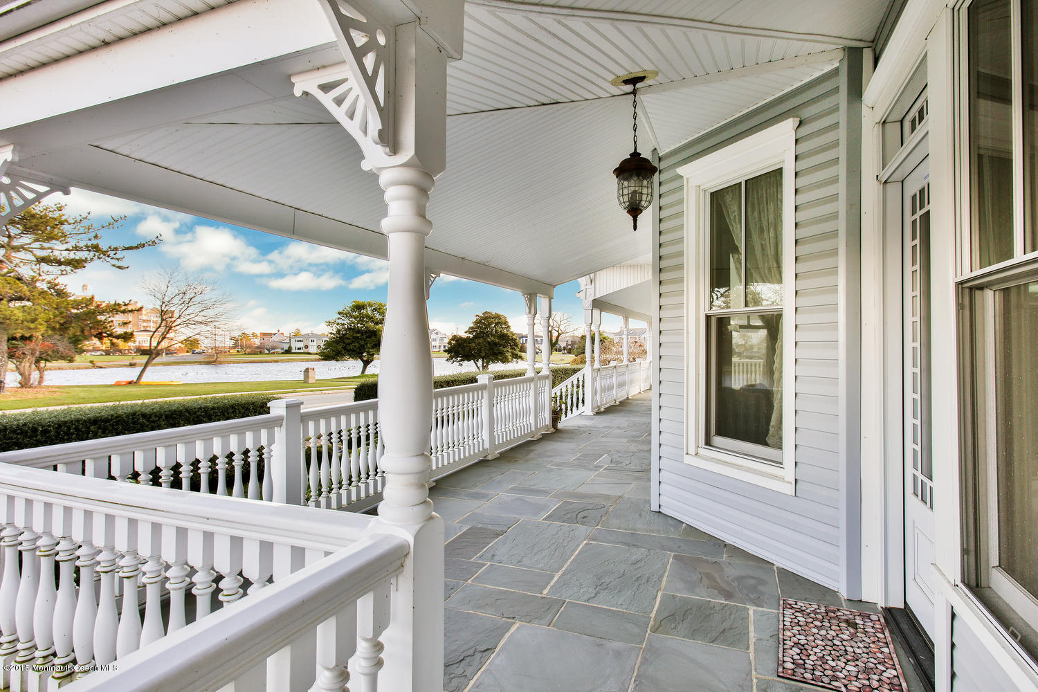 203 East Lake Avenue Spring Lake, NJ 07762 - Photo 42 of 55 a view of a porch with wooden floor