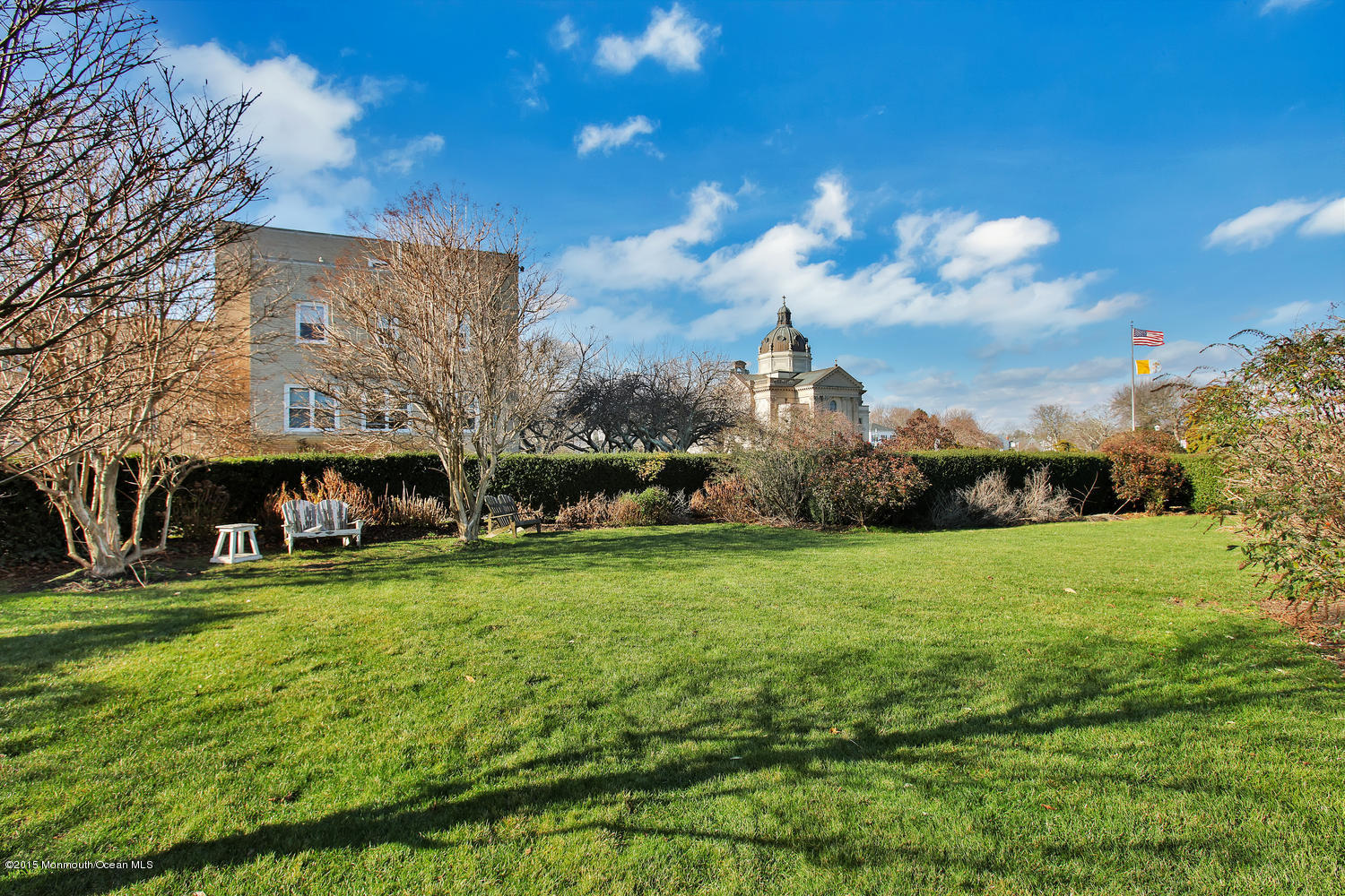 203 East Lake Avenue Spring Lake, NJ 07762 - Photo 45 of 55 a view of a building with a garden