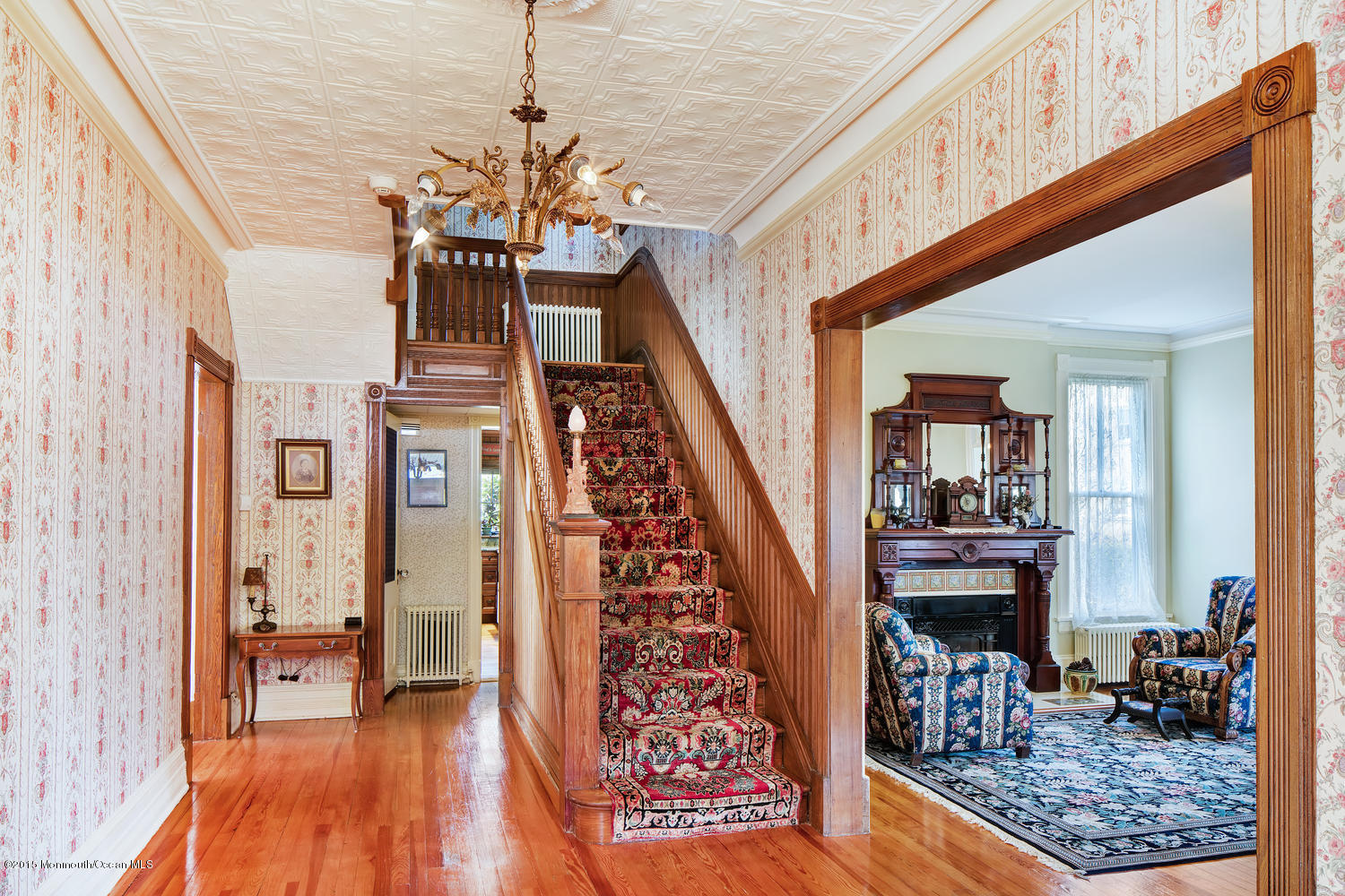 203 East Lake Avenue Spring Lake, NJ 07762 - Photo 10 of 55 a view of entryway livingroom and hall with wooden floor