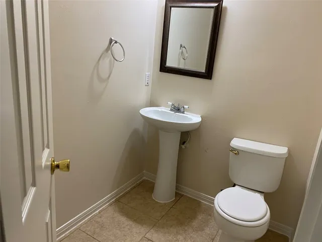 a bathroom with a toilet and a sink
