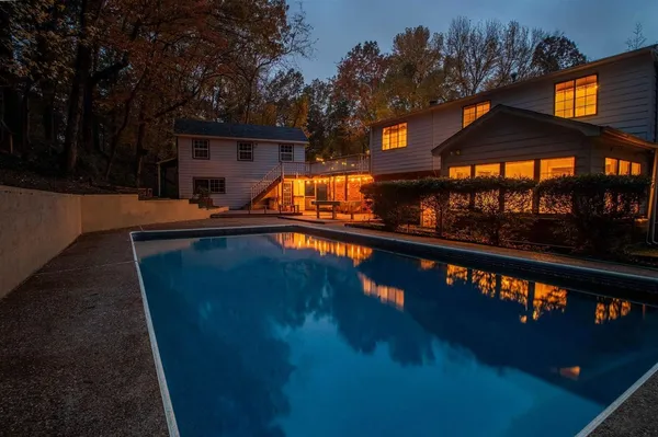 a view of a house with swimming pool