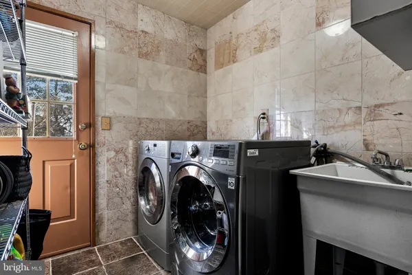 a utility room with dryer and washer
