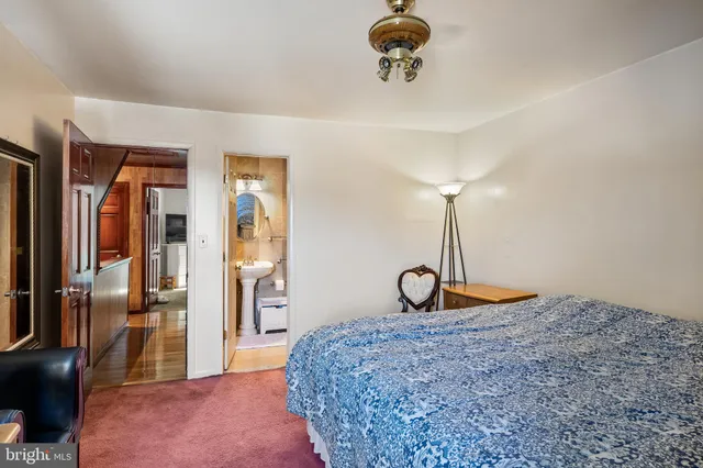 a bedroom with furniture and a chandelier