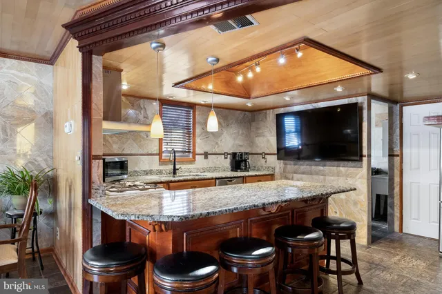 a kitchen with a table and chairs in it