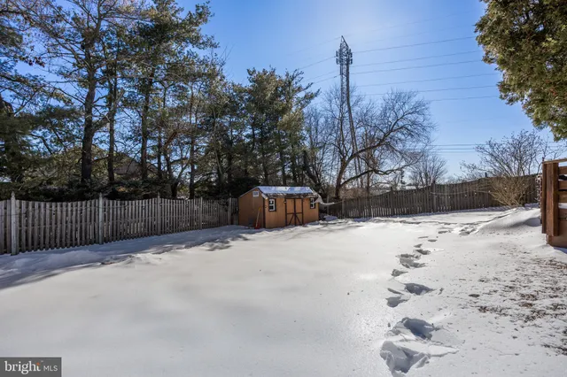 a backyard of a house with large trees