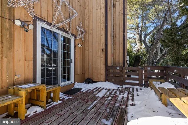 a view of balcony with wooden floor and outdoor seating