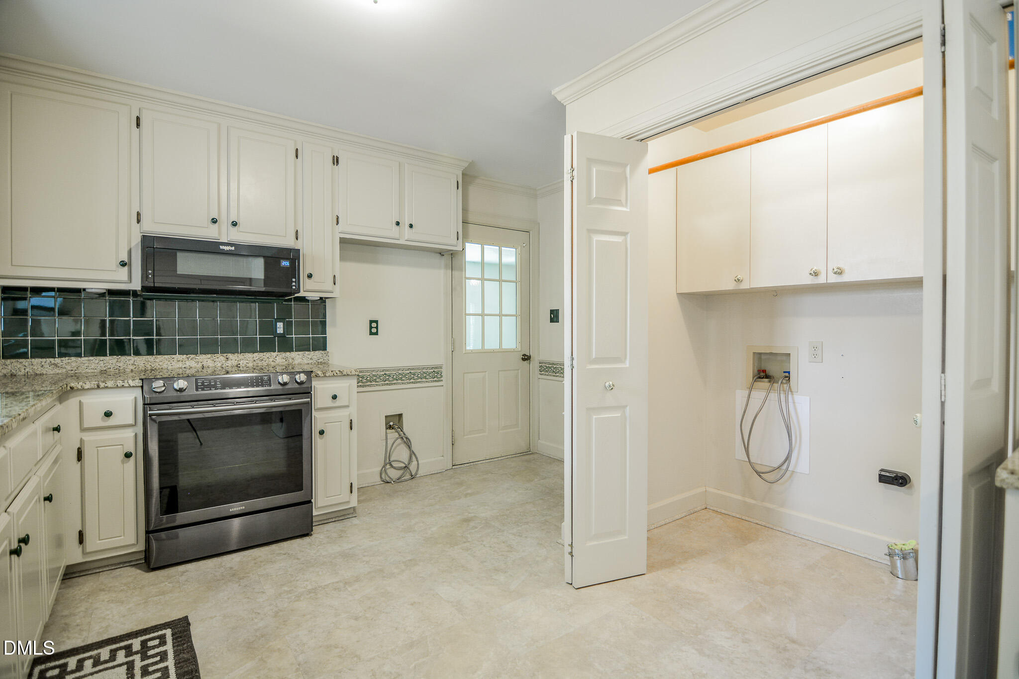 1215 Cambridge Road Northwest Wilson, NC 27896 - Photo 28 of 54 a kitchen with white cabinets and white appliances