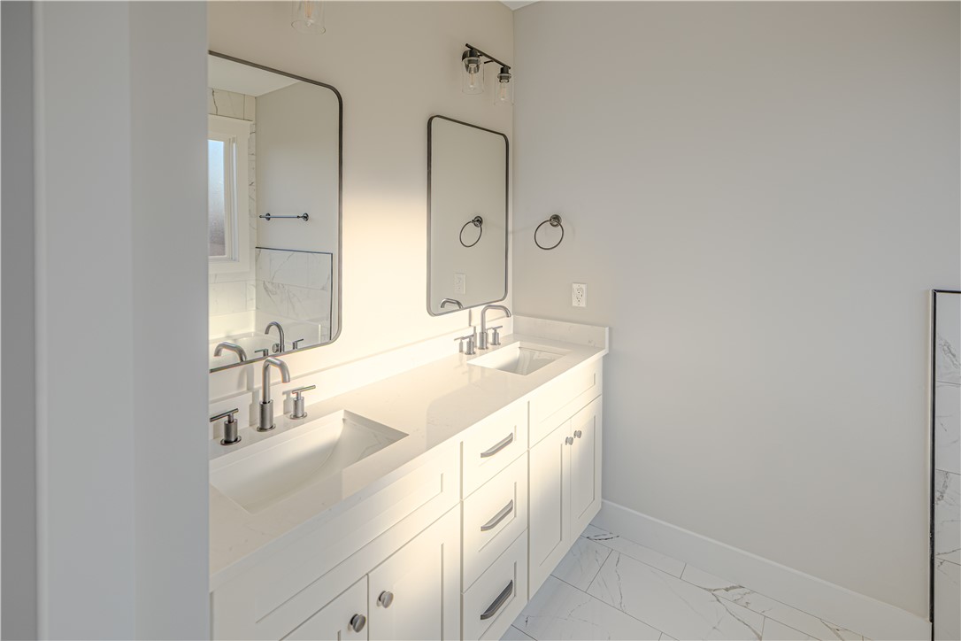 1409 Stonehurst Road Anderson, SC 29621 - Photo 11 of 37 This bright bathroom features a spacious double vanity with ample storage and modern fixtures.