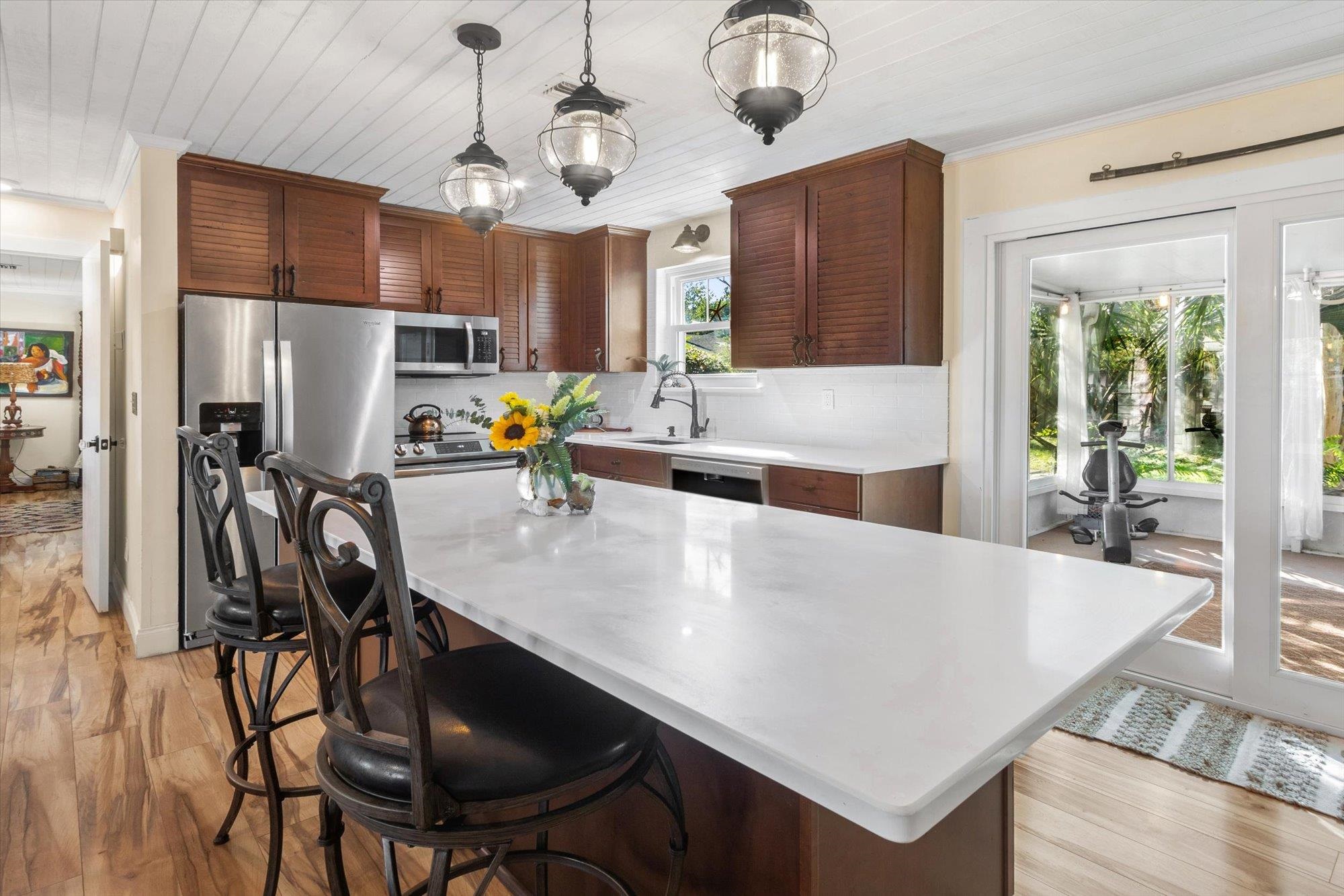 120 Swallow Road St. Augustine, FL 32086 - Photo 11 of 42 a kitchen with stainless steel appliances granite countertop a sink a stove and a refrigerator