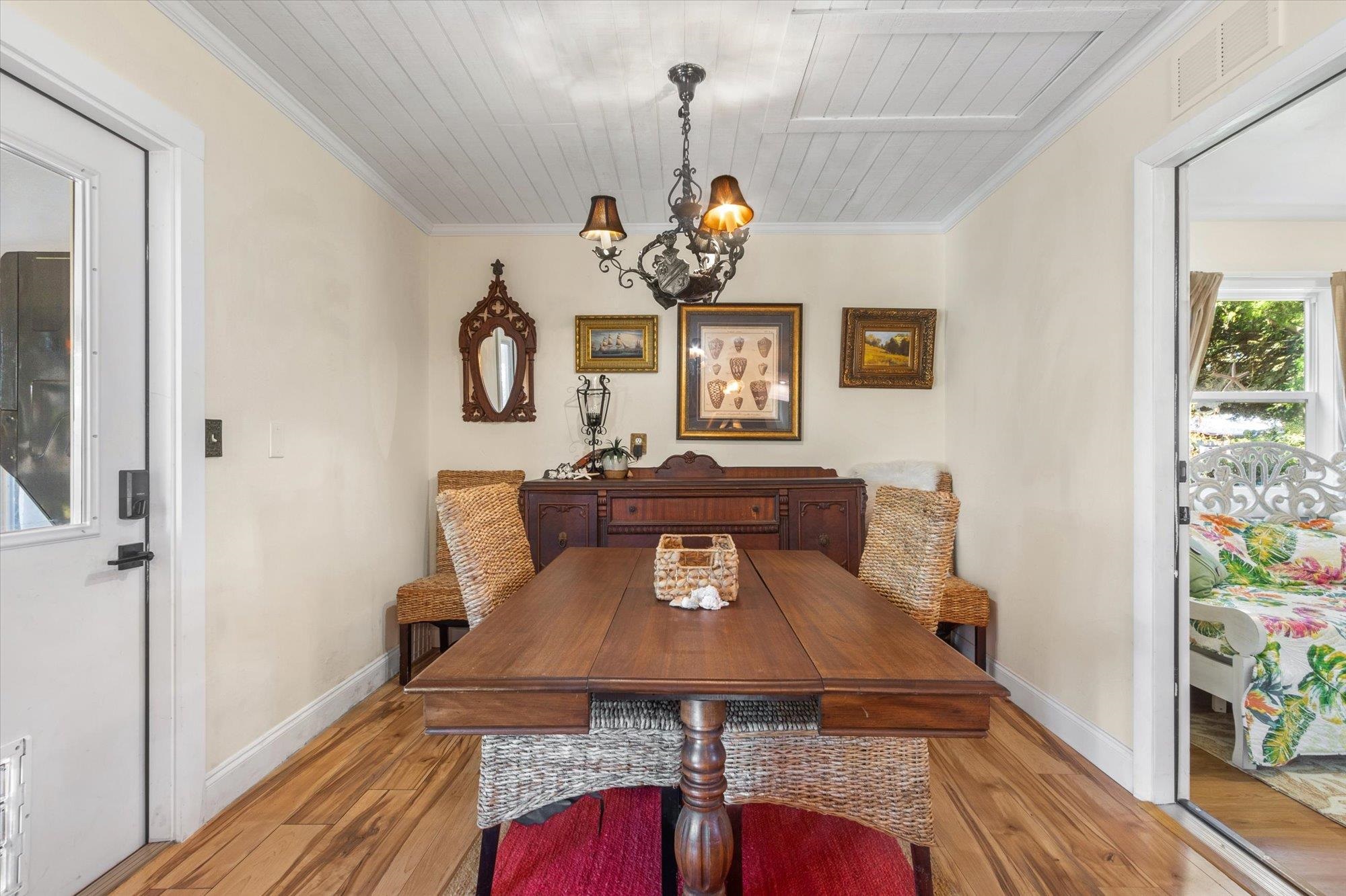 120 Swallow Road St. Augustine, FL 32086 - Photo 13 of 42 a view of a dining room with furniture and wooden floor