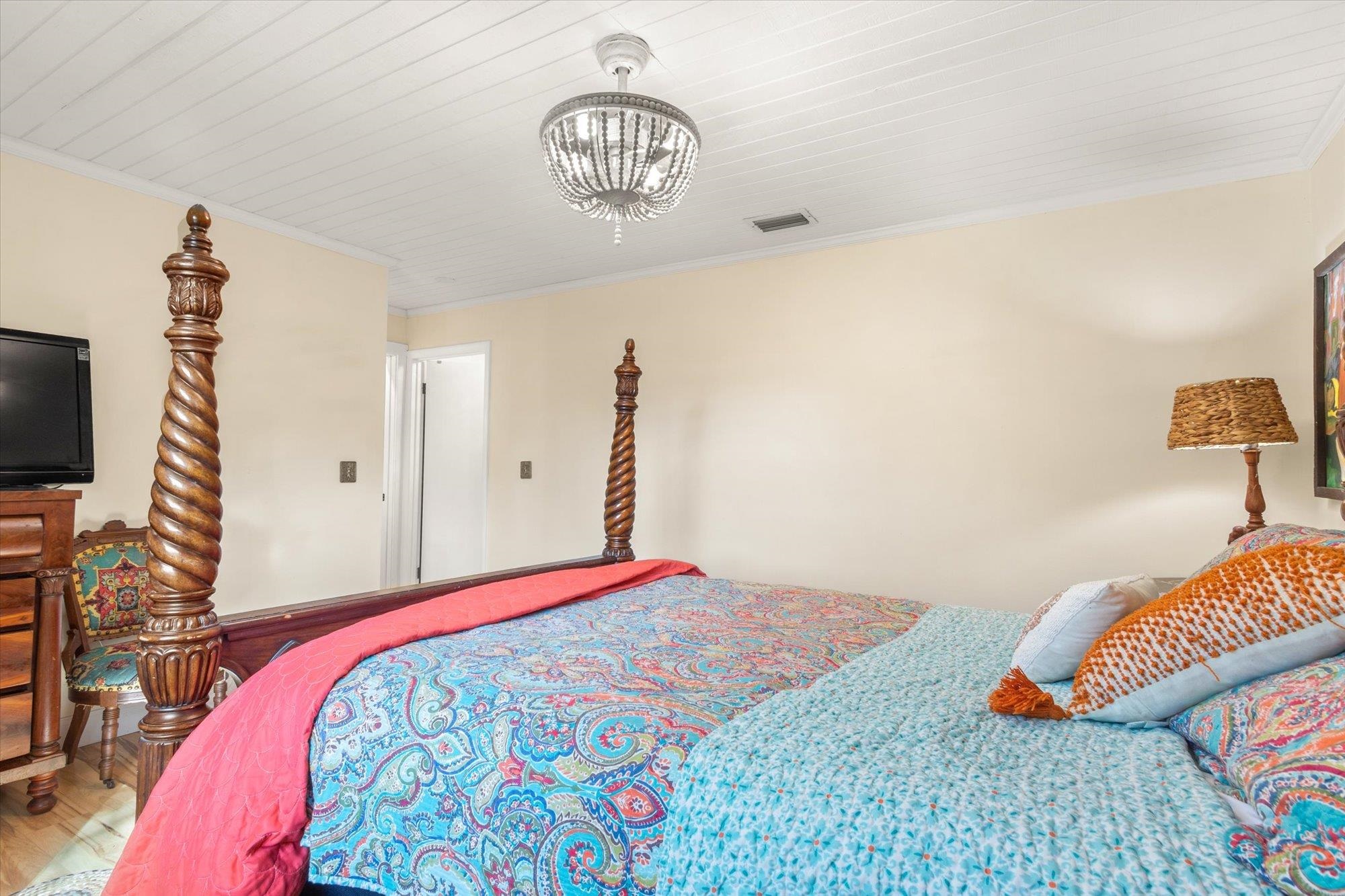 120 Swallow Road St. Augustine, FL 32086 - Photo 15 of 42 a bedroom with a bed and a flat screen tv