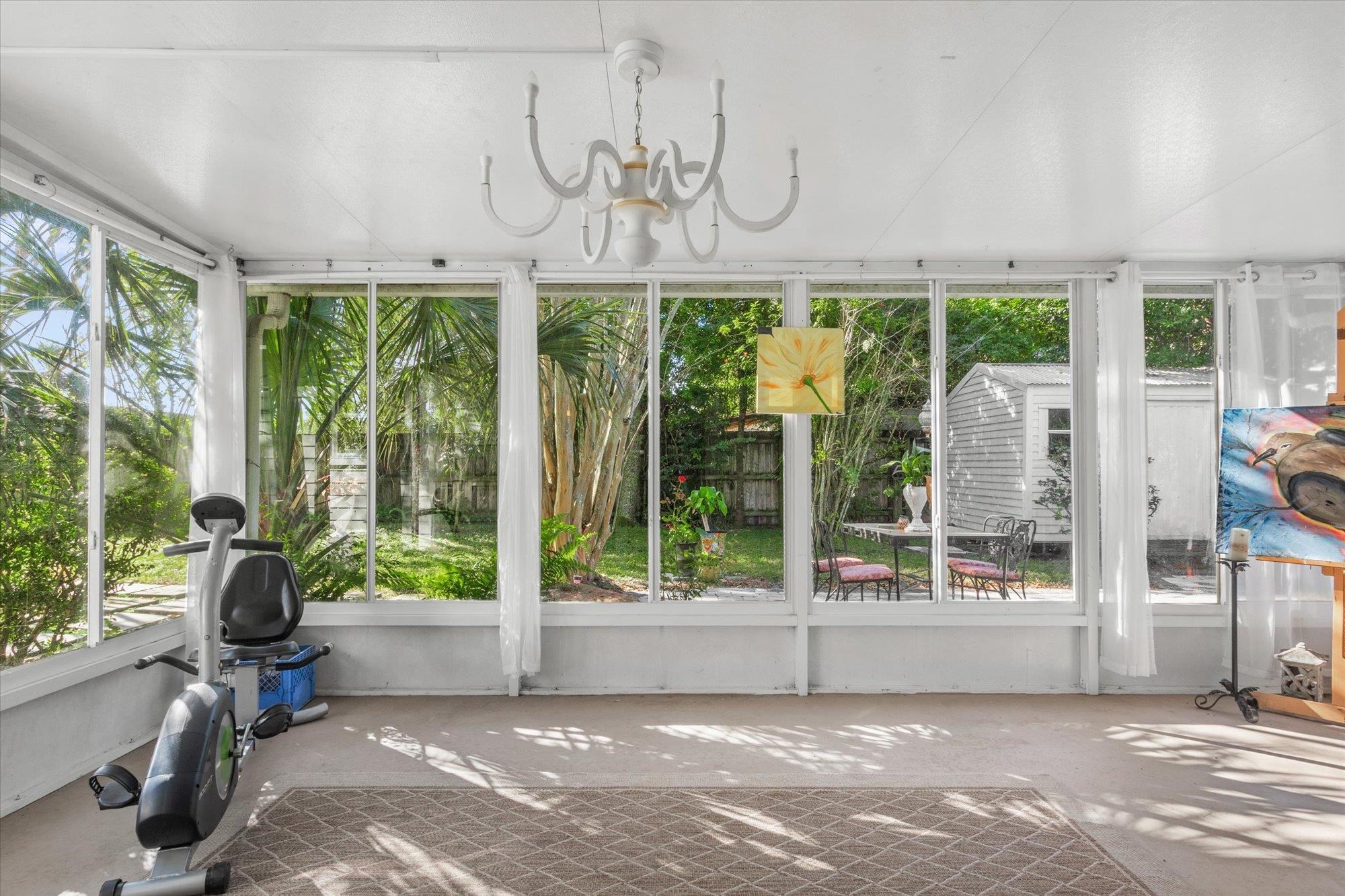 120 Swallow Road St. Augustine, FL 32086 - Photo 22 of 42 a view of a room with furniture large windows and plants