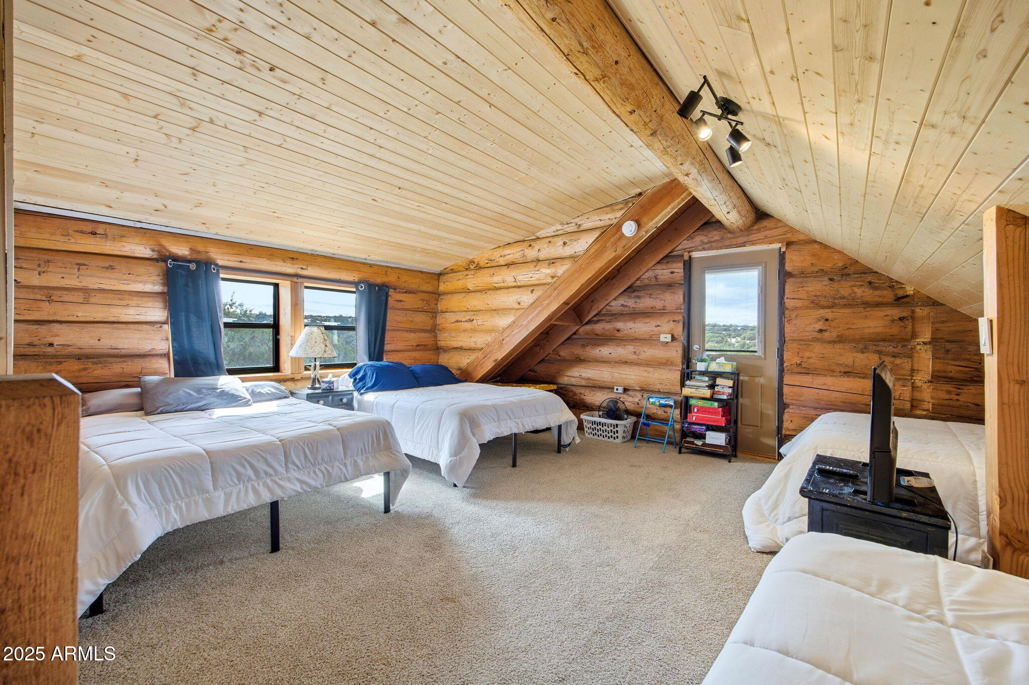 1904 Ponce Place Show Low, AZ 85901 - Photo 18 of 43 a bedroom with furniture and a large window