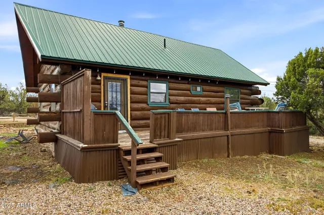 a bedroom with a bed and a ceiling fan
