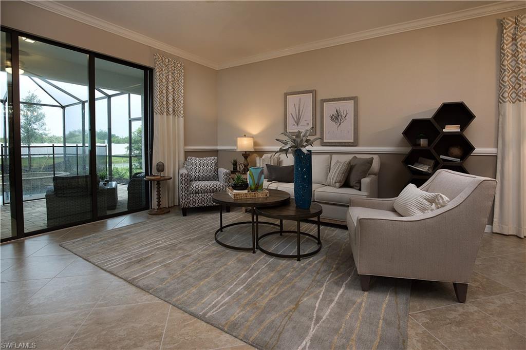 19396 Elston Way Estero, FL 33928 - Photo 2 of 14 a living room with furniture and a large window