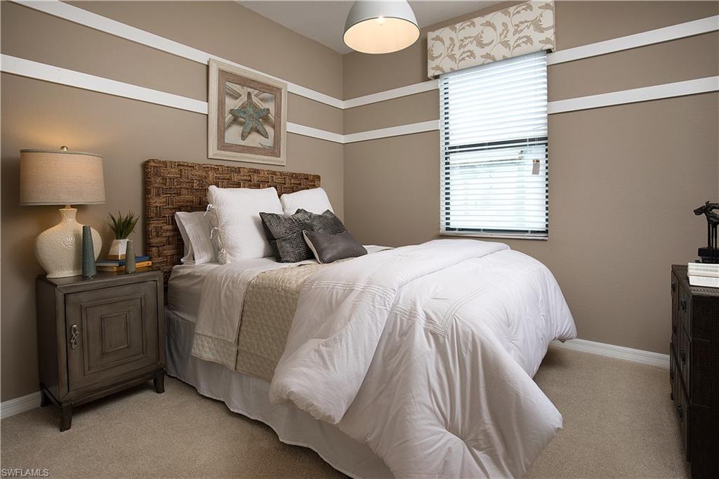 19396 Elston Way Estero, FL 33928 - Photo 8 of 14 a bedroom with a bed and window