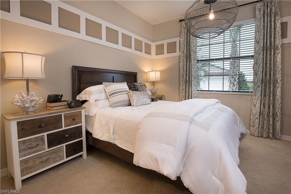 19396 Elston Way Estero, FL 33928 - Photo 9 of 14 a bedroom with a bed and a window