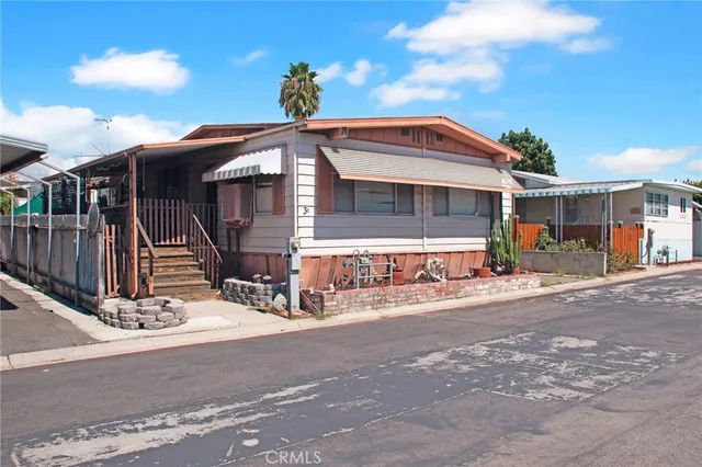 a front view of a house with yard