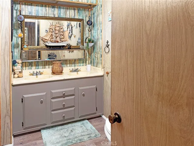 a view of bathroom with a window and mirror